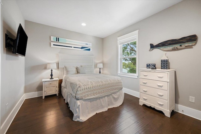 bedroom featuring dark hardwood / wood-style flooring