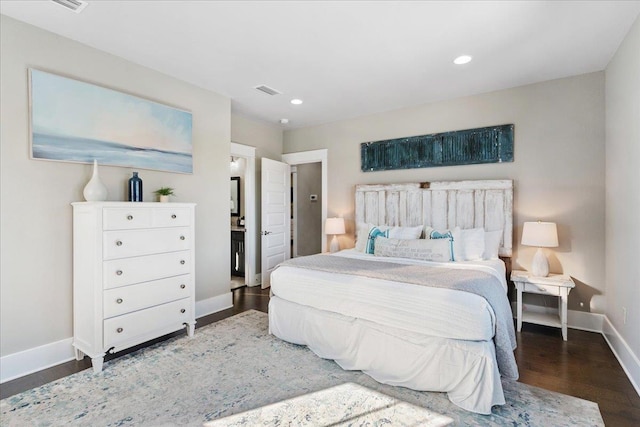 bedroom featuring dark hardwood / wood-style flooring