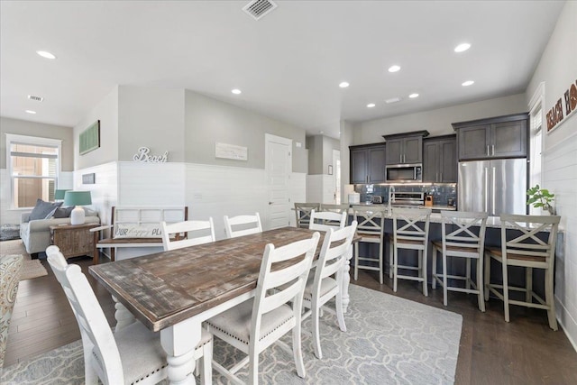 dining room with dark hardwood / wood-style floors