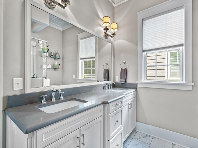 1207 Braemore Way, Tallahassee, FL 32308 - bathroom featuring marble look tiles, ornamental molding, double vanity, and baseboards