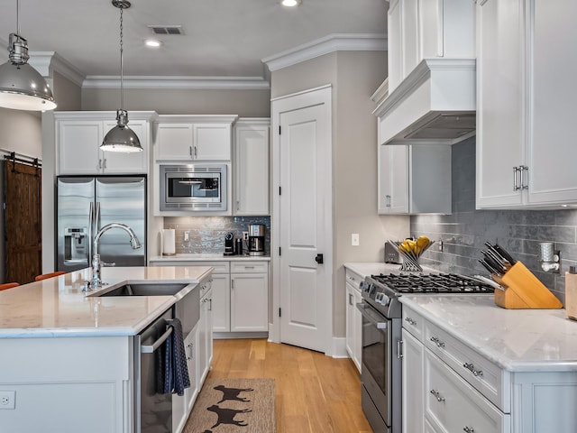 1207 Braemore Way, Tallahassee, FL 32308 - kitchen with stainless steel appliances, a sink, light wood-style flooring, tasteful backsplash, and ornamental molding