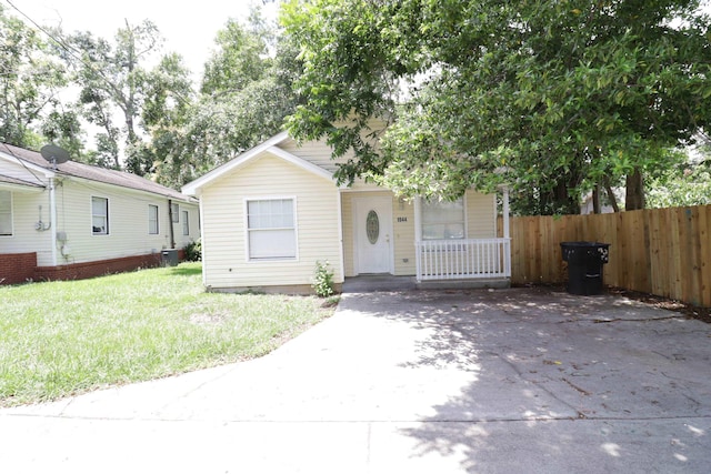 1944 Pasco St, Tallahassee, FL 32310 - view of property hidden behind natural elements featuring driveway and central air condition unit