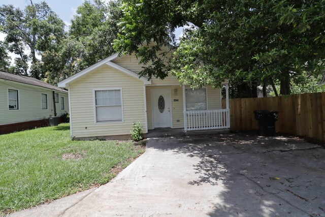 1944 Pasco St, Tallahassee, FL 32310 - view of front of house featuring a porch and central AC