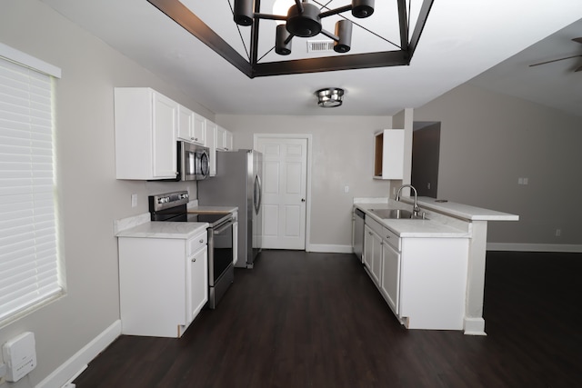 1944 Pasco St, Tallahassee, FL 32310 - kitchen featuring appliances with stainless steel finishes, dark wood-style floors, baseboards, and a sink