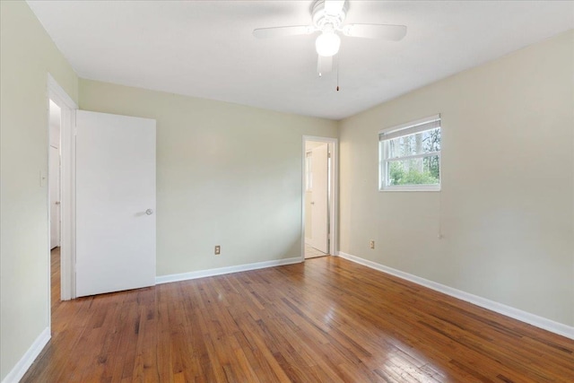 unfurnished bedroom with ceiling fan, baseboards, and hardwood / wood-style flooring