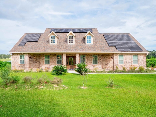 cape cod home with solar panels and a front lawn