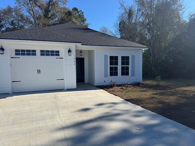 single story home featuring a garage