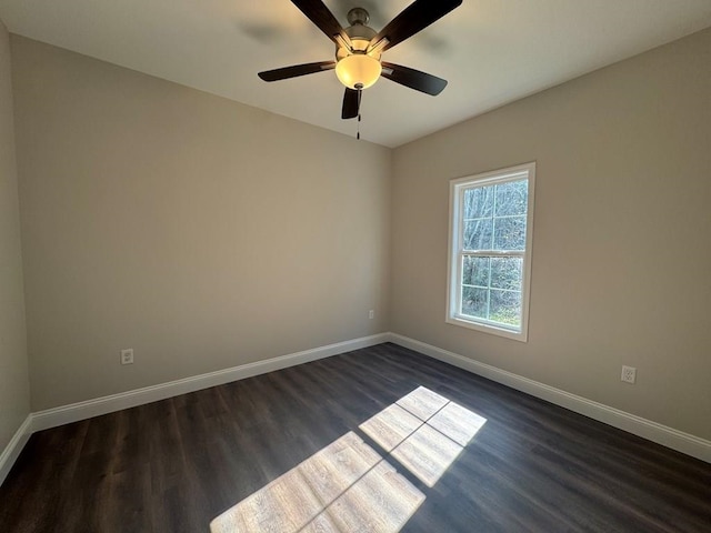 unfurnished room featuring dark hardwood / wood-style floors and ceiling fan