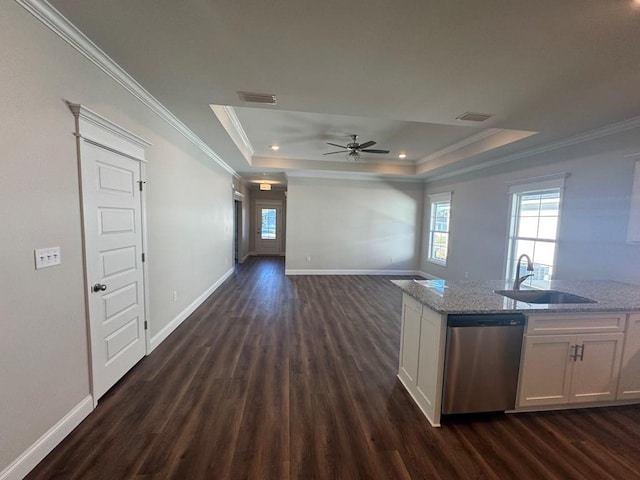 kitchen featuring a raised ceiling, light stone countertops, dishwasher, and white cabinets