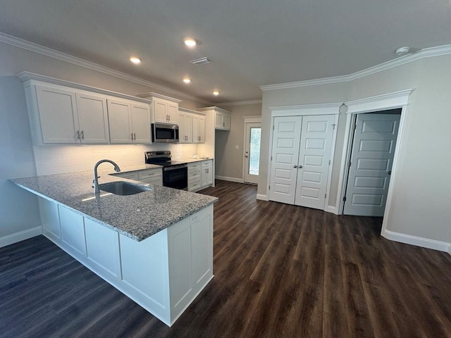 kitchen featuring decorative backsplash, kitchen peninsula, dark hardwood / wood-style flooring, stainless steel appliances, and white cabinetry