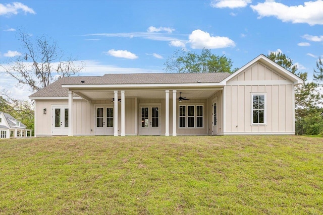 rear view of house featuring a lawn, ceiling fan, and french doors