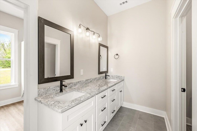 bathroom featuring tile patterned floors and vanity