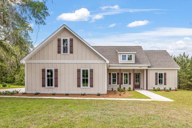 view of front of property with a porch and a front yard