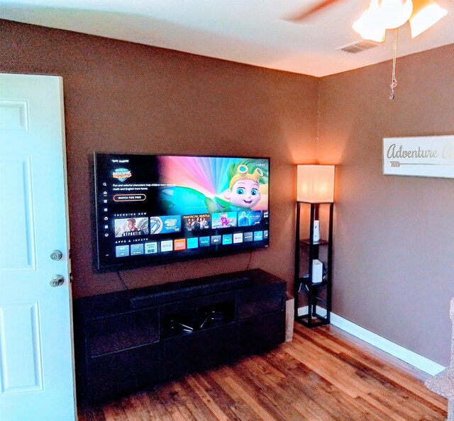 1508 Pepper Dr, Tallahassee, FL 32304 - living area with wood finished floors, ceiling fan, and baseboards