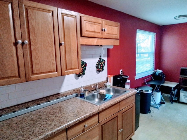 1508 Pepper Dr, Tallahassee, FL 32304 - kitchen featuring a sink, backsplash, and light flooring