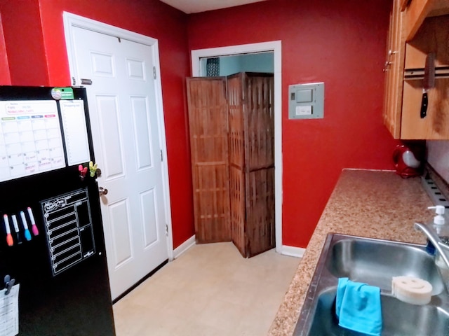 1508 Pepper Dr, Tallahassee, FL 32304 - kitchen with a sink, light flooring, and baseboards