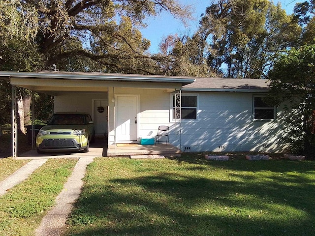 1508 Pepper Dr, Tallahassee, FL 32304 - ranch-style home featuring a front lawn, a carport, and driveway
