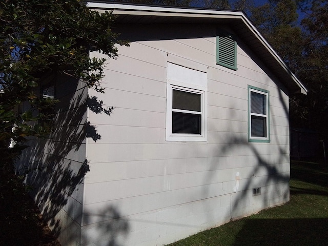 1508 Pepper Dr, Tallahassee, FL 32304 - view of side of home with crawl space and a lawn