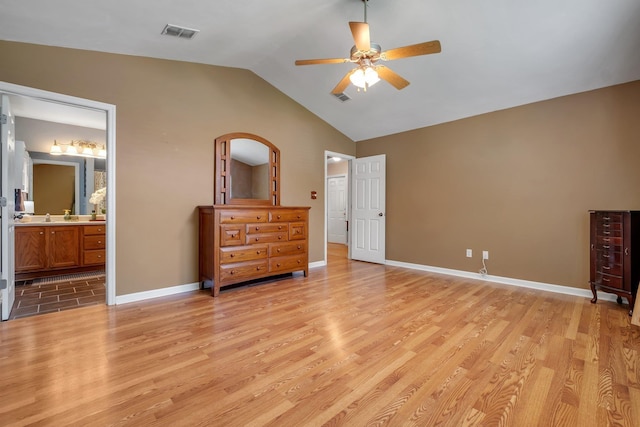 5529 Green Meadows Ct, Tallahassee, FL 32303 - bedroom with light wood-style flooring, vaulted ceiling, a ceiling fan, and ensuite bathroom