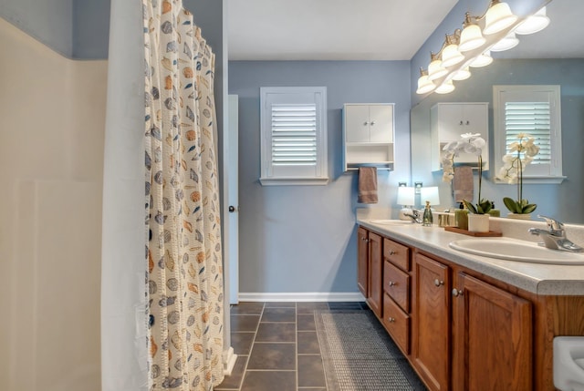 5529 Green Meadows Ct, Tallahassee, FL 32303 - full bathroom with double vanity, healthy amount of natural light, tile patterned floors, and a shower with curtain