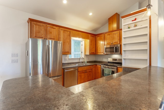 kitchen featuring stainless steel appliances, dark countertops, lofted ceiling, a sink, and a peninsula