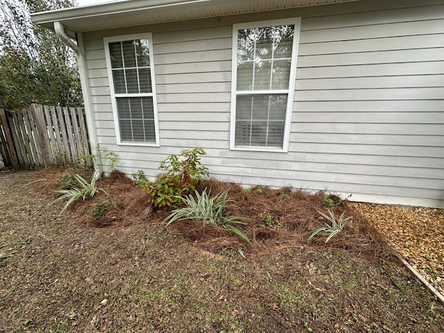 view of side of property with fence