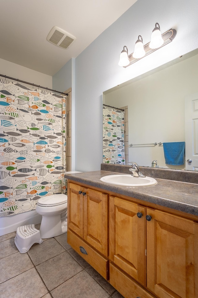 full bathroom with toilet, tile patterned flooring, visible vents, and vanity