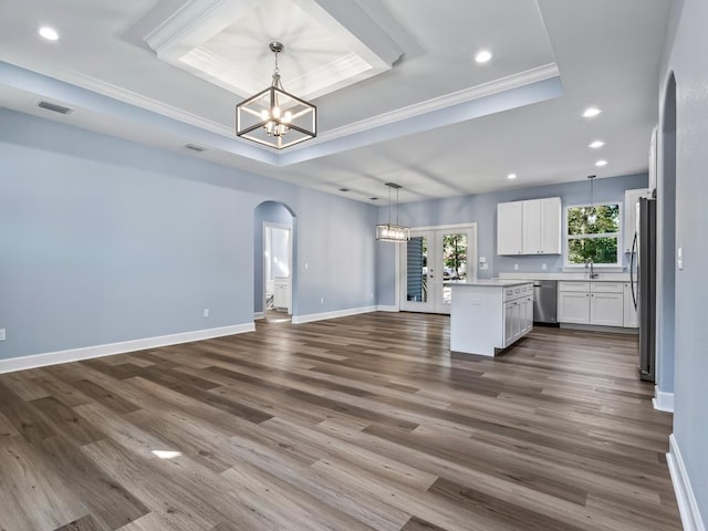 10356 Crystalline Ct, Tallahassee, FL 32305 - kitchen featuring a raised ceiling, appliances with stainless steel finishes, a chandelier, open floor plan, and crown molding