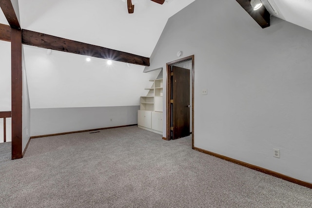 interior space with ceiling fan, vaulted ceiling with beams, and rail lighting