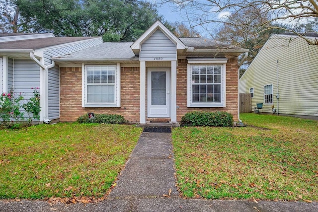 view of front of home with a front yard