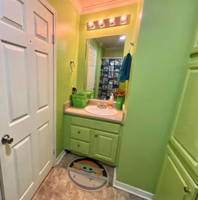 bathroom featuring vanity and ornamental molding