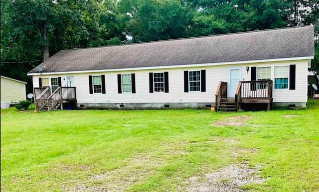 view of front of home featuring a deck and a front lawn