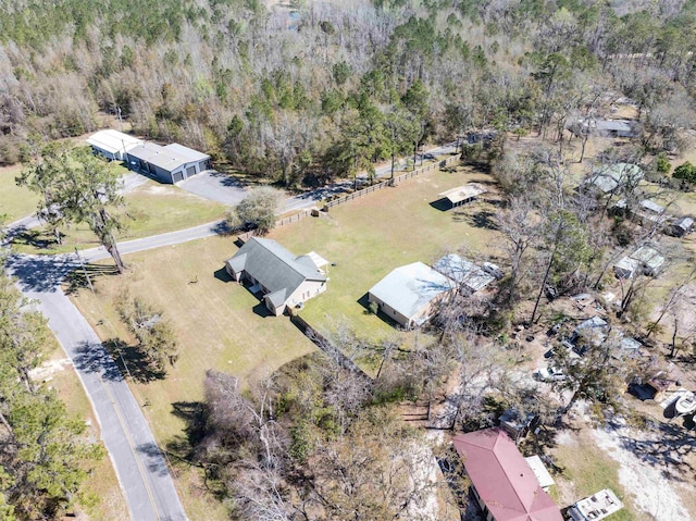 drone / aerial view featuring a forest view