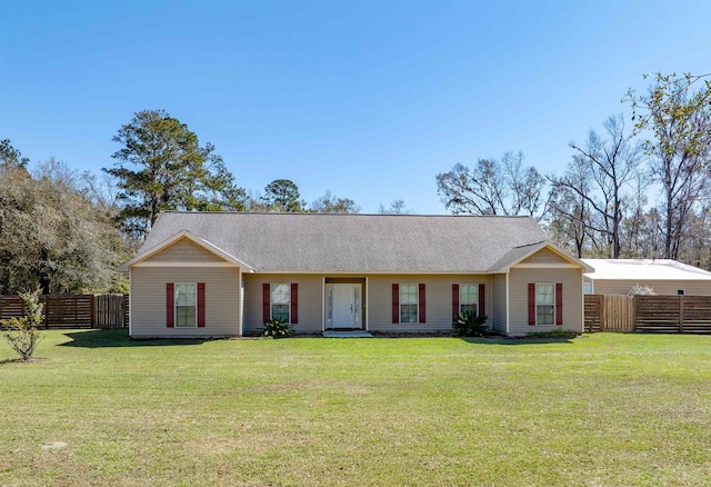 single story home featuring a front yard, fence, and a shingled roof