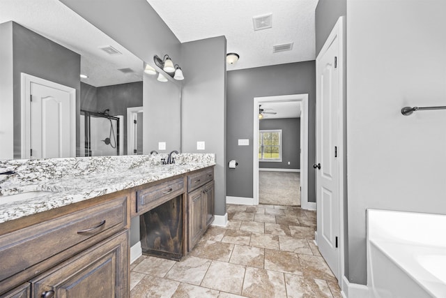 full bathroom with a shower stall, double vanity, a ceiling fan, and visible vents