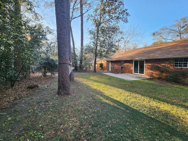 view of yard with a patio area