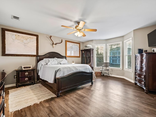 bedroom featuring ceiling fan and dark hardwood / wood-style flooring