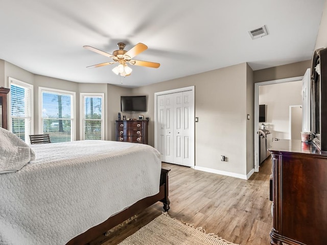 bedroom with ceiling fan and light hardwood / wood-style floors