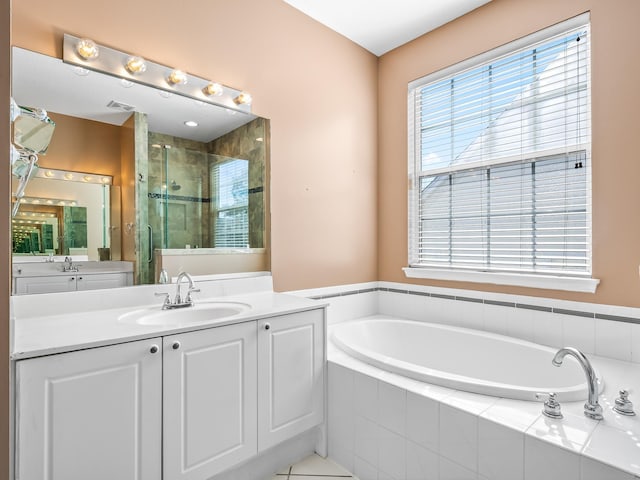 2123 Fernleigh Dr, Tallahassee, FL 32311 - full bathroom featuring a stall shower, a garden tub, and vanity