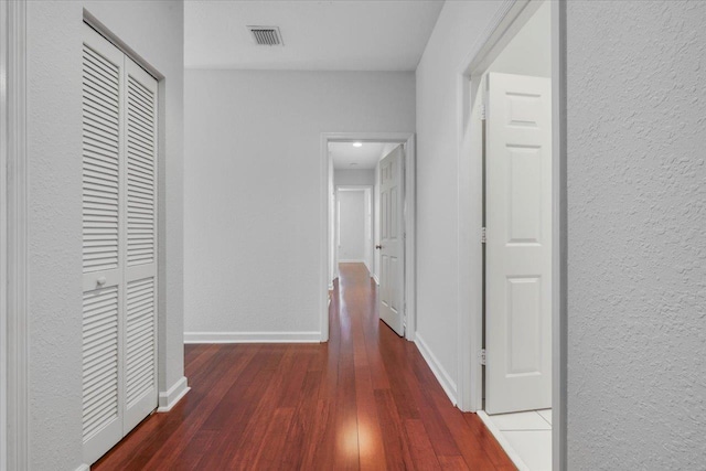 2123 Fernleigh Dr, Tallahassee, FL 32311 - corridor featuring wood finished floors, baseboards, and a textured wall
