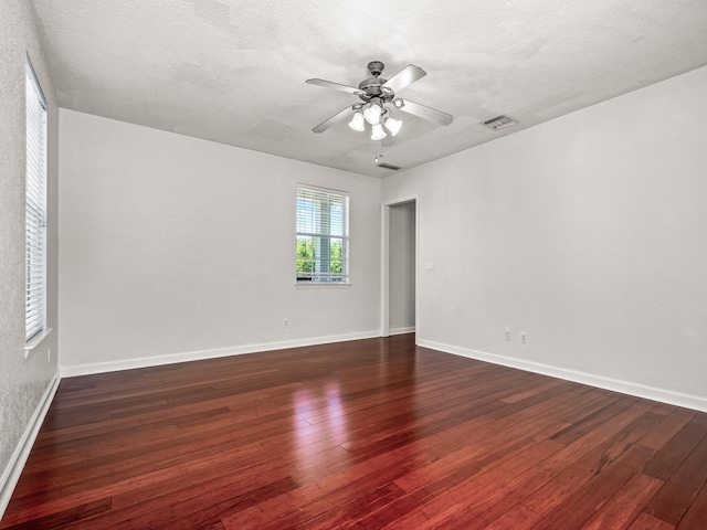 2123 Fernleigh Dr, Tallahassee, FL 32311 - unfurnished room featuring a ceiling fan, dark wood finished floors, baseboards, and a textured ceiling