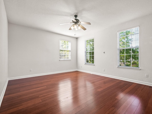 2123 Fernleigh Dr, Tallahassee, FL 32311 - spare room featuring ceiling fan, dark wood finished floors, baseboards, and a textured ceiling