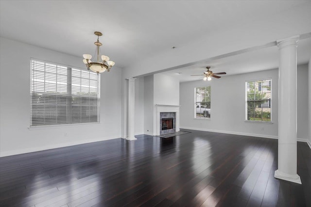 2123 Fernleigh Dr, Tallahassee, FL 32311 - unfurnished living room featuring decorative columns, a premium fireplace, dark wood-style floors, a ceiling fan, and baseboards