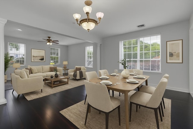 2123 Fernleigh Dr, Tallahassee, FL 32311 - dining room featuring ornate columns, plenty of natural light, wood finished floors, and baseboards
