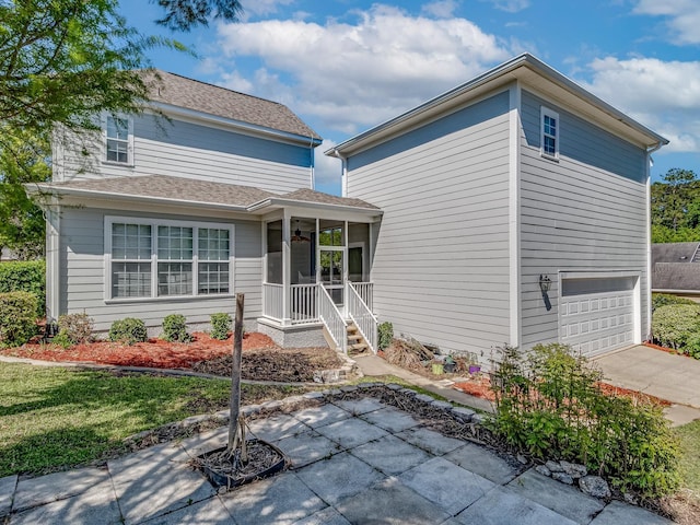 2123 Fernleigh Dr, Tallahassee, FL 32311 - view of front of property featuring a garage, a porch, and concrete driveway