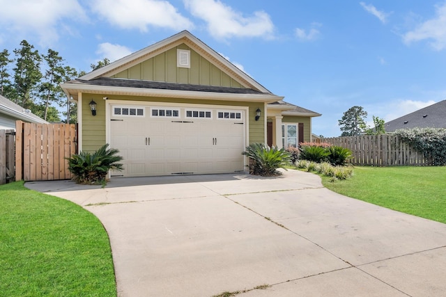 view of front of home with a garage and a front lawn