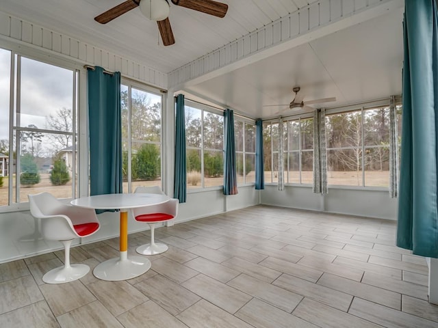 sunroom / solarium featuring ceiling fan