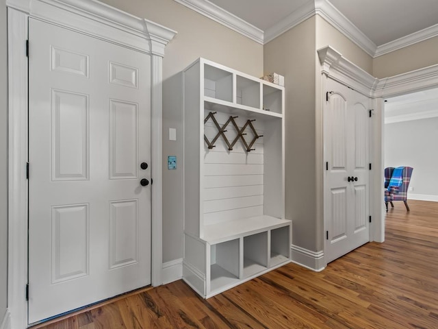 mudroom with crown molding and hardwood / wood-style floors