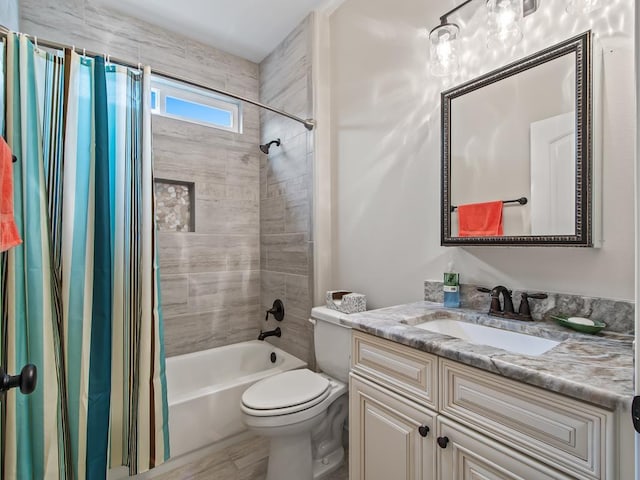 full bathroom featuring vanity, shower / bath combination with curtain, and toilet