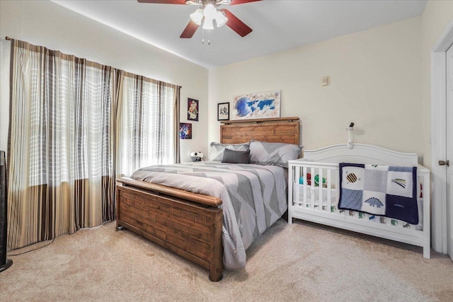 bedroom with ceiling fan and carpet floors